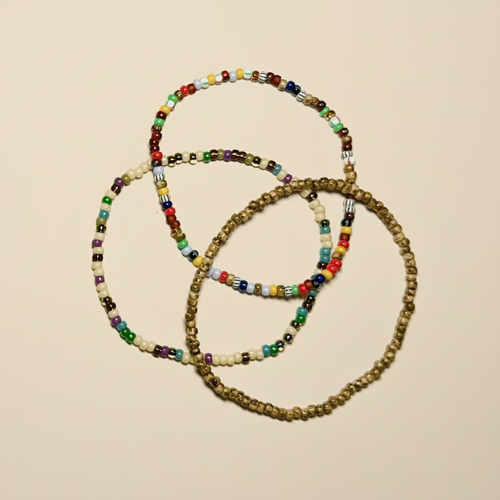 beed bracelets stacked on a white surface